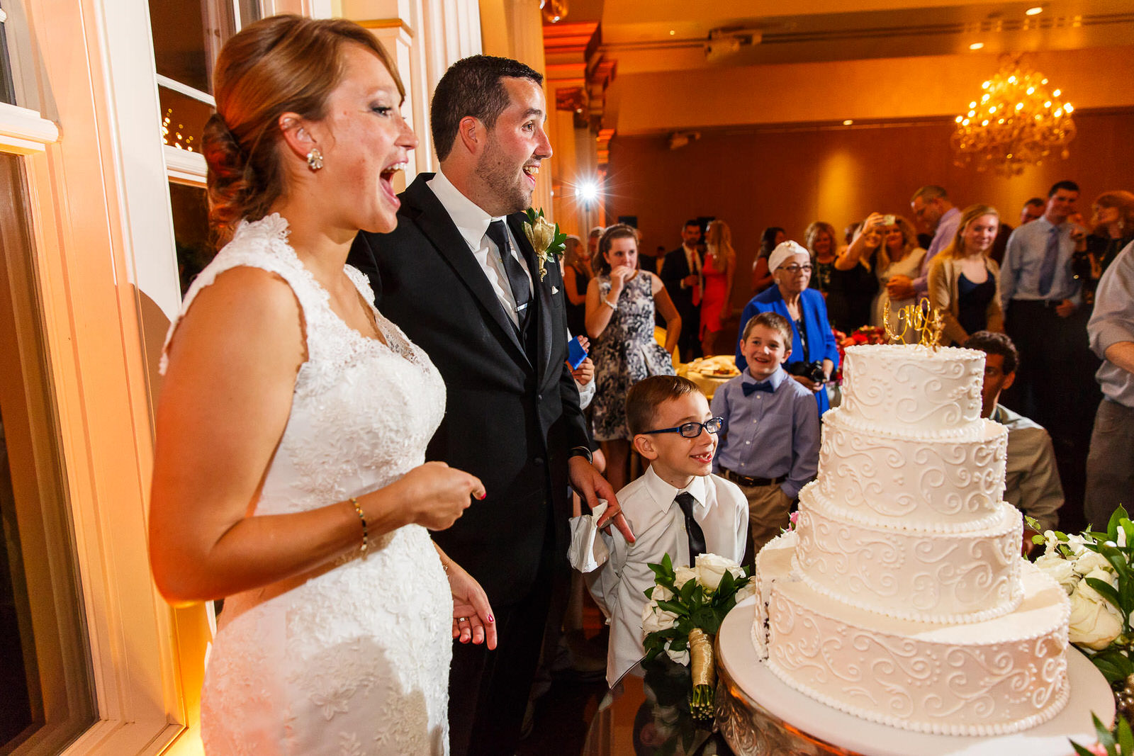 Bride and Groom Cut Their Wedding Cake at The Riverview